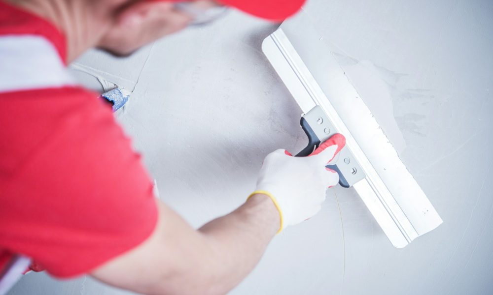 Drywall Patch by Worker