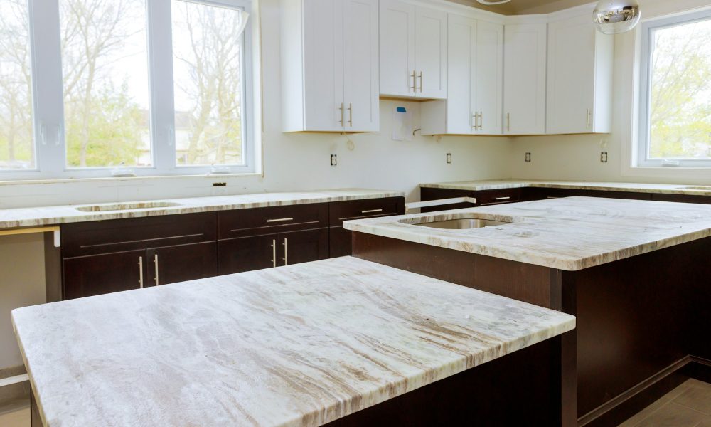 Home improvement and interior design new white kitchen renovation installing cabinets and counter